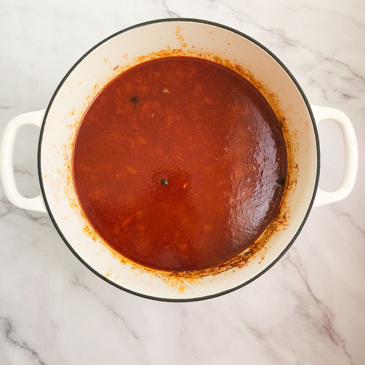 Greek lamb and tomato stew in pot simmering