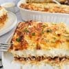 Greek pasta bake, pastitsio, on white plate with fork