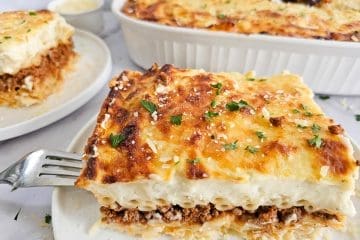 Greek pasta bake, pastitsio, on white plate with fork