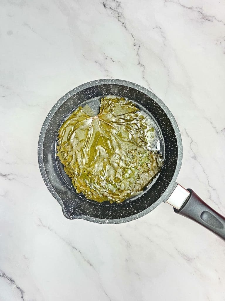 blanched vine leaves in pot.