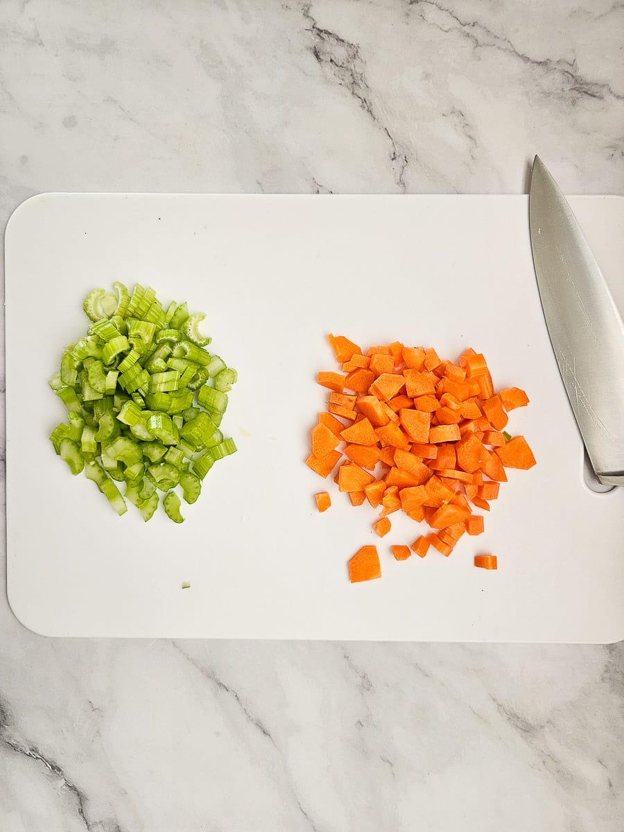 chopped carrot and celery on chopping board