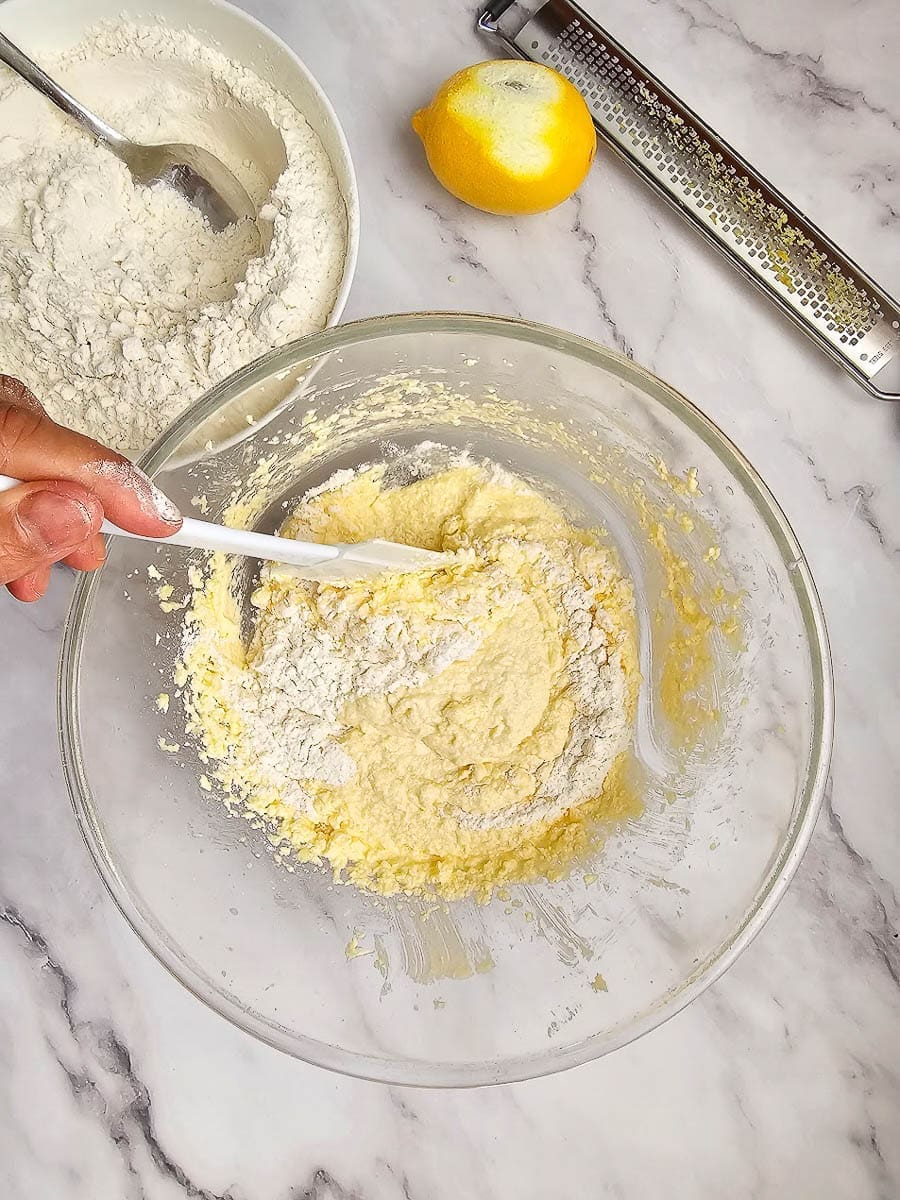 Greek Easter cookies-koulourakia fold in flour.