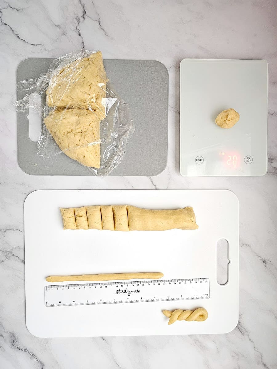 Greek Easter cookies-koulourakia dough, measure length and weigh on scales