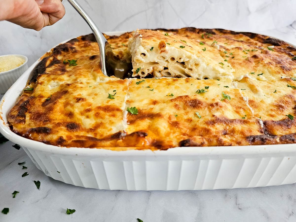 Greek pasta bake-pastitsio in white baking dish - ready for service