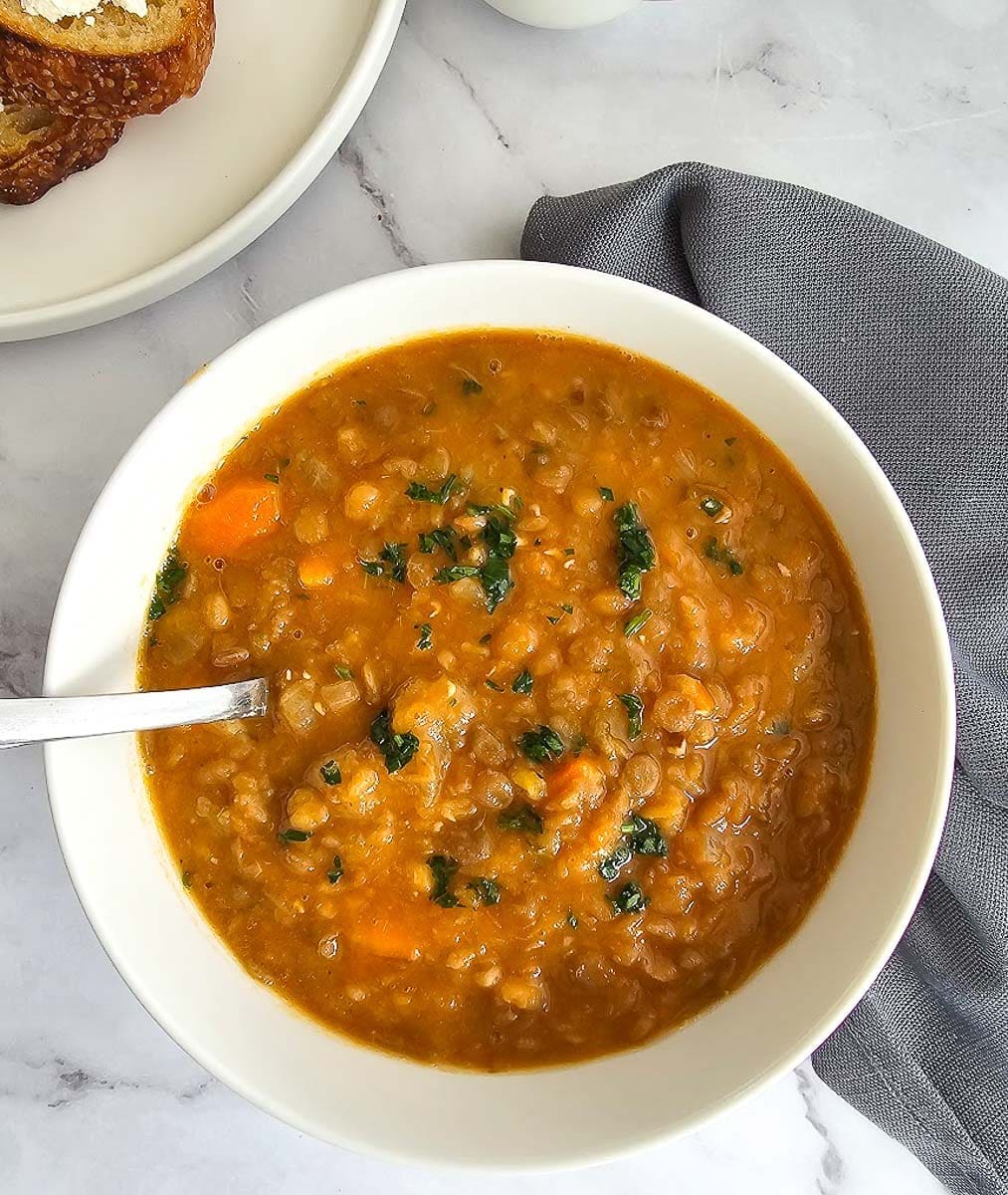 Greek lentil soup-fakes-in a white bowl