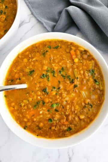 Greek lentil soup-fakes-in a white bowl