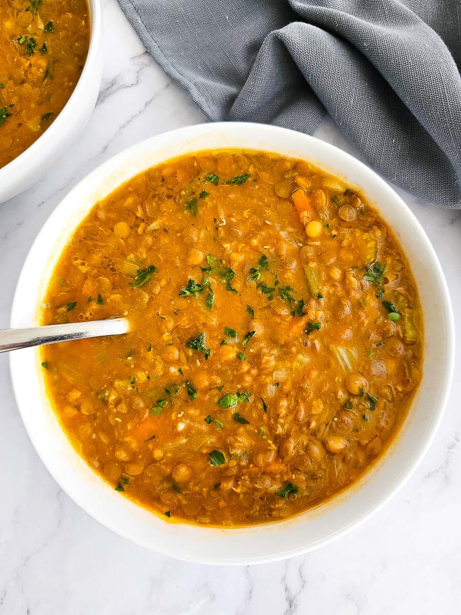 Greek lentil soup-fakes-in a white bowl