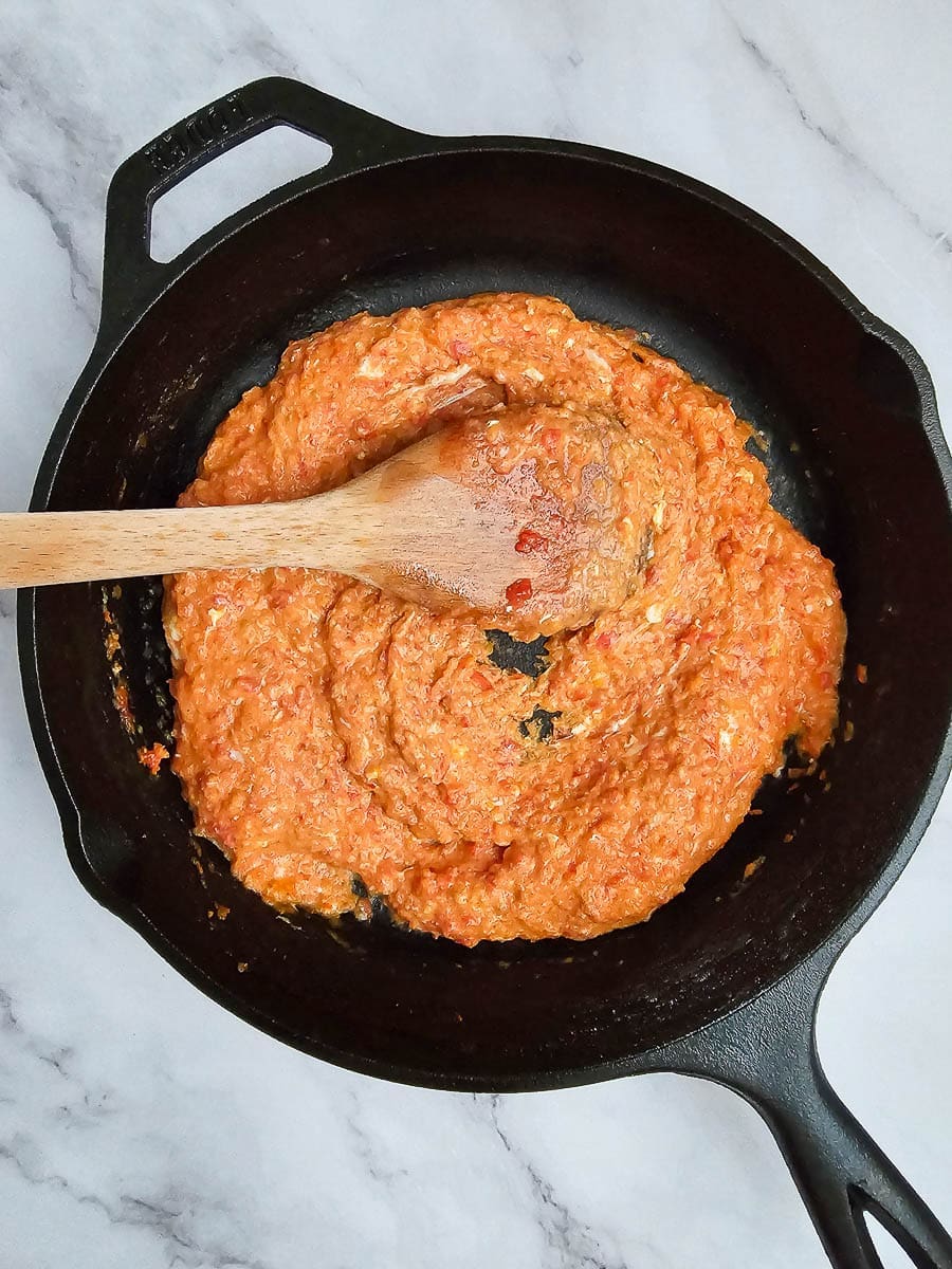 Strapadsada-Greek scrambled eggs and tomatoes in a pan.