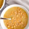 Chickpea soup in a bowl with a spoon