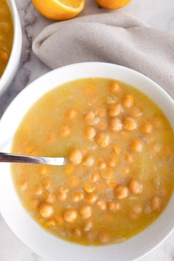 Chickpea soup in a bowl with a spoon