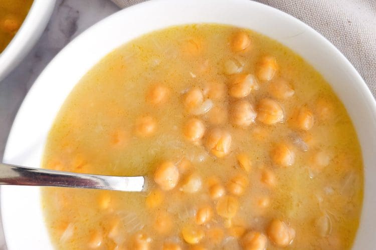 Chickpea soup in a bowl with a spoon