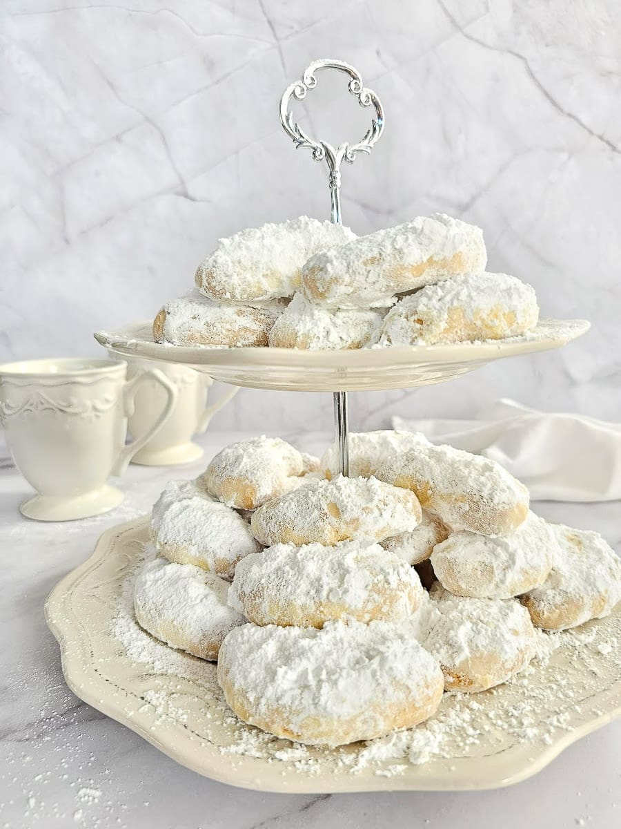 Greek Almond Shortbread Cookies-Kourambiedes-on white plate- ready to serve- high tea