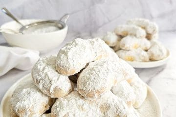 Greek Almond Shortbread Cookies-Kourambiedes-on white plate