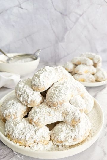 Greek Almond Shortbread Cookies-Kourambiedes-on white plate