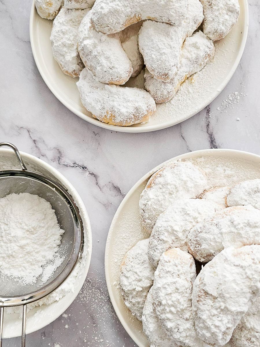 Greek Almond Shortbread Cookies-Kourambiedes-on white plate