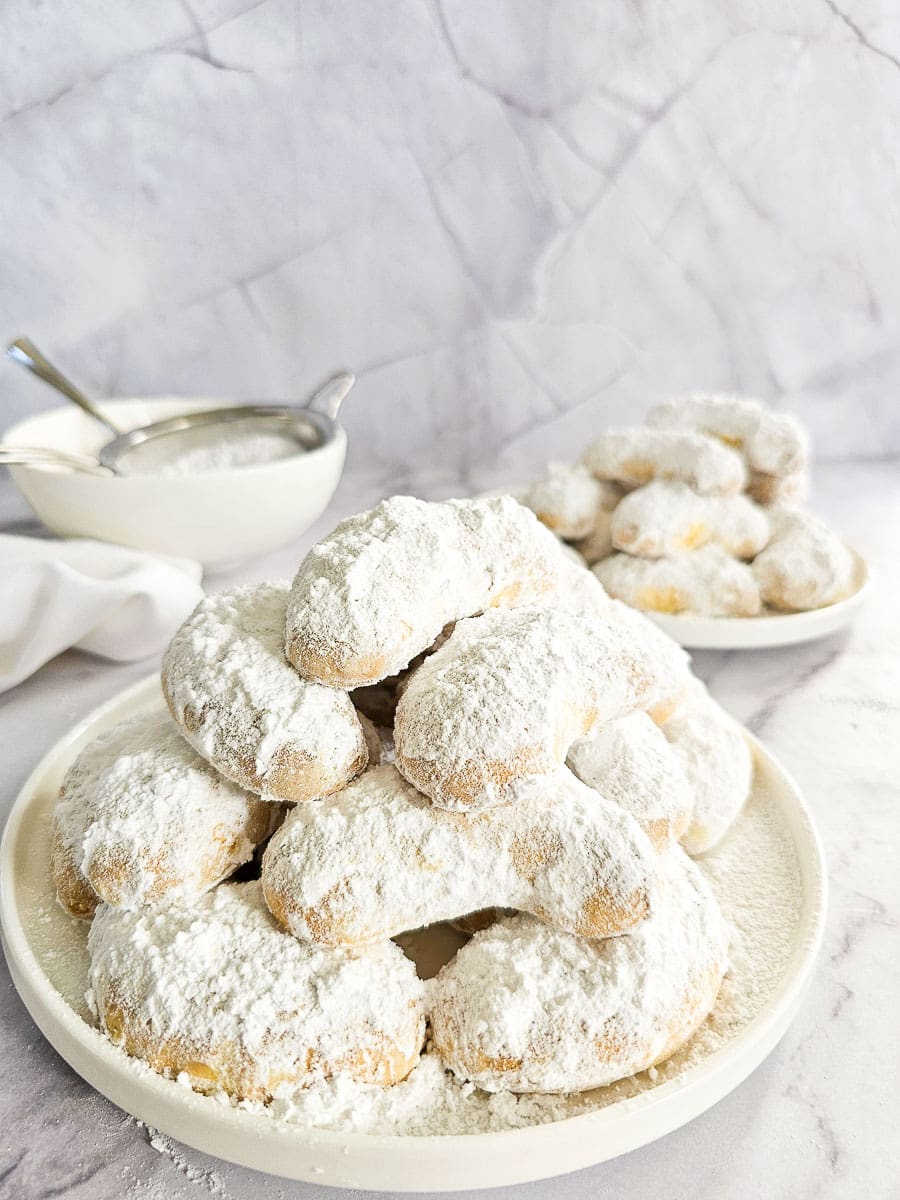 Greek Almond Shortbread Cookies-Kourambiedes-on white plate 