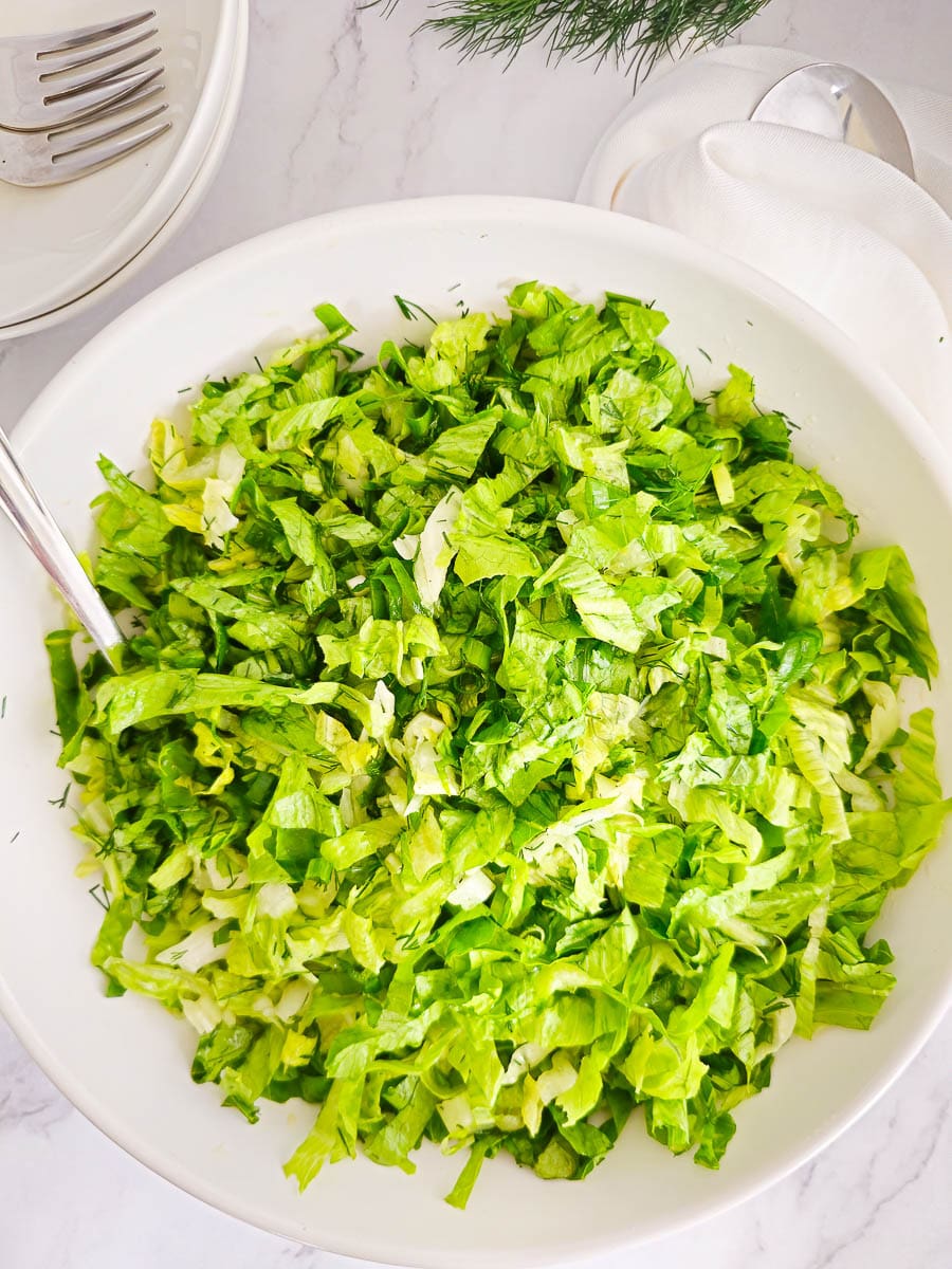 Greek lettuce salad - maroulosalata - in a whte bowl