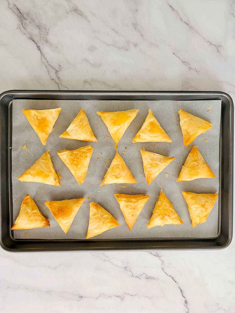 Greek Cheese Triangles, Tiropitakia, on baking tray