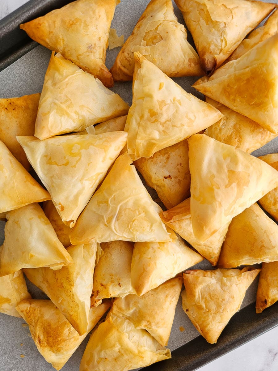 Greek Cheese Triangles, Tiropitakia, on baking tray