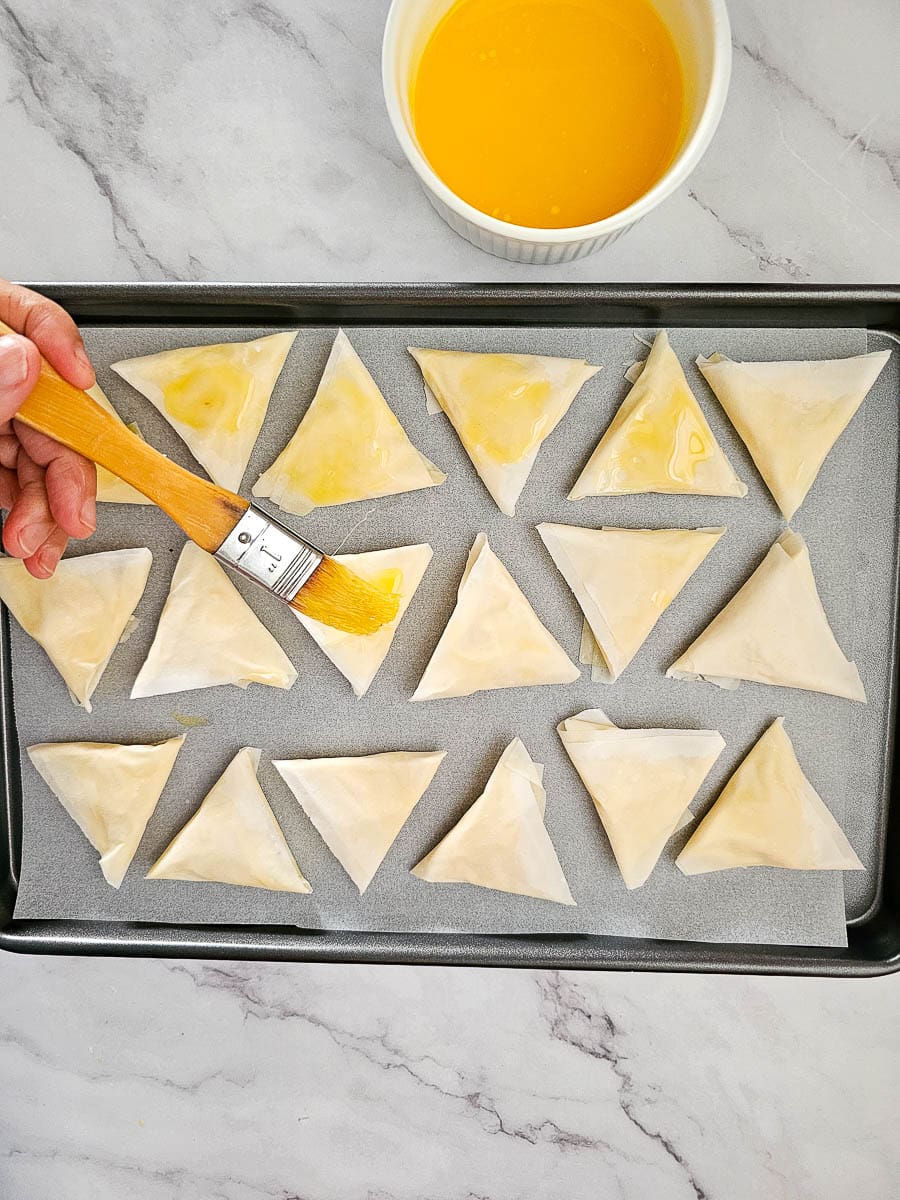 Greek Cheese Triangles, Tiropitakia, before baking on tray