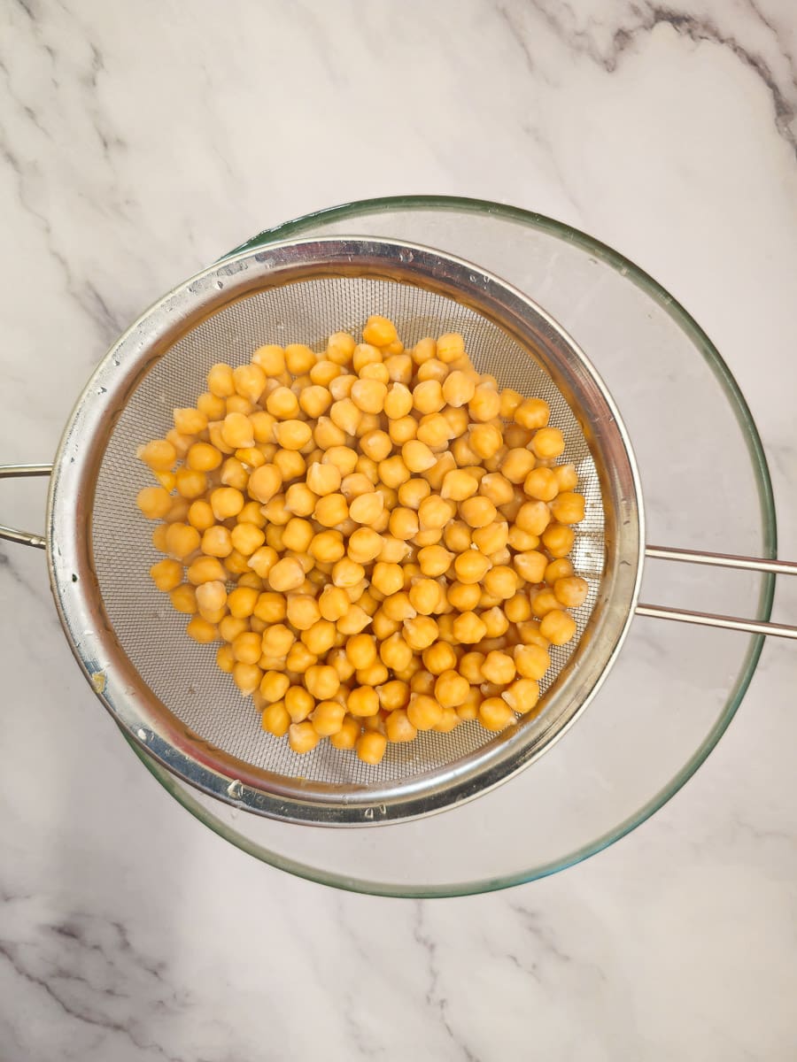 chickpeas straining in bowl