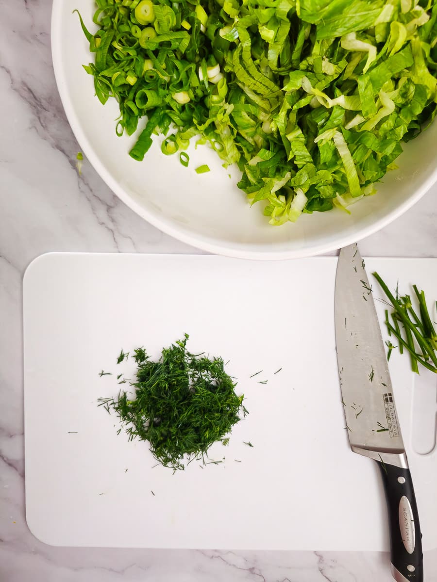 finely chopped dill on a chopping board