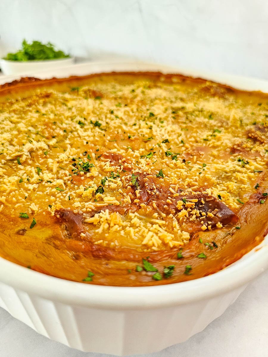 baked vegan moussaka in a white baking dish