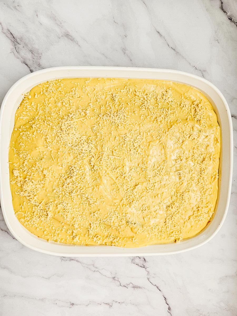 vegan moussaka in baking dish, uncooked before going in oven