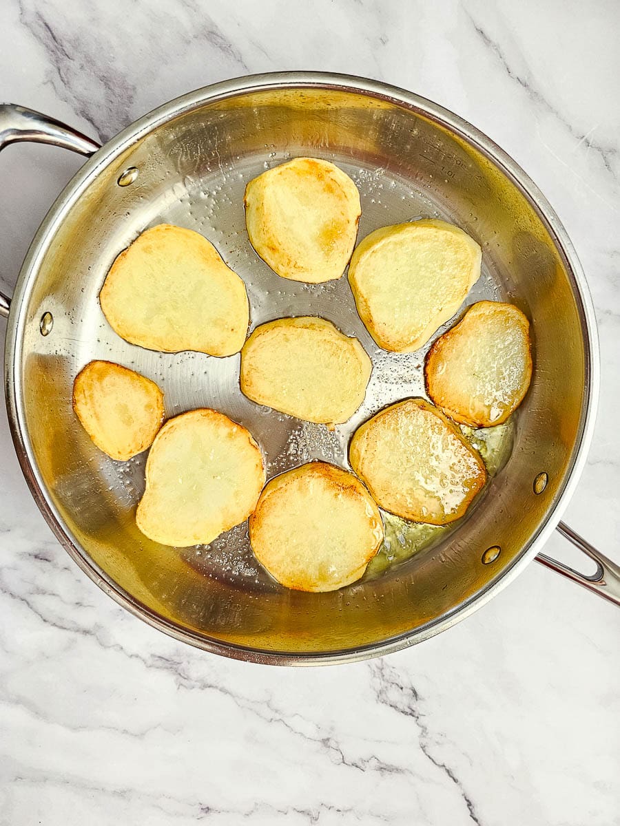 shallow frying sliced potatoes