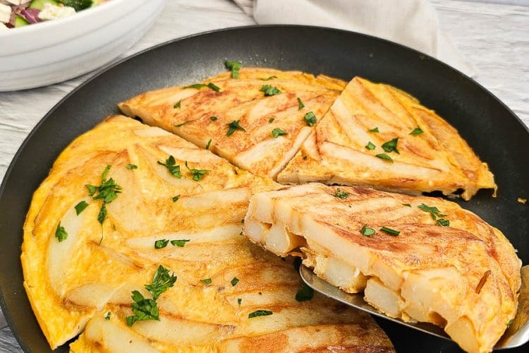 Greek Style Potato Omelette in a frying pan