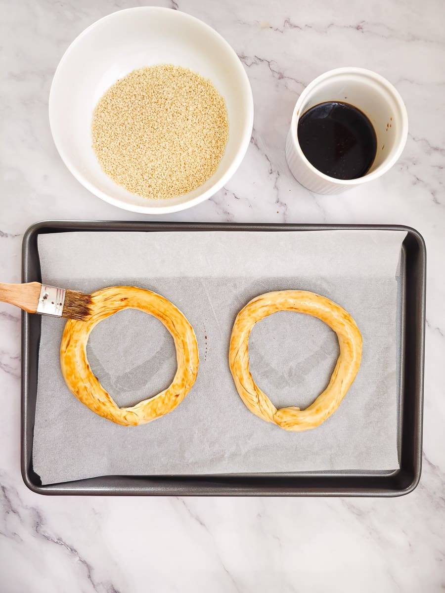 Greek Sesame Bread Rings - Koulouri Thessaloniki - brushing with Petimezi - Pekmez - grape syrup