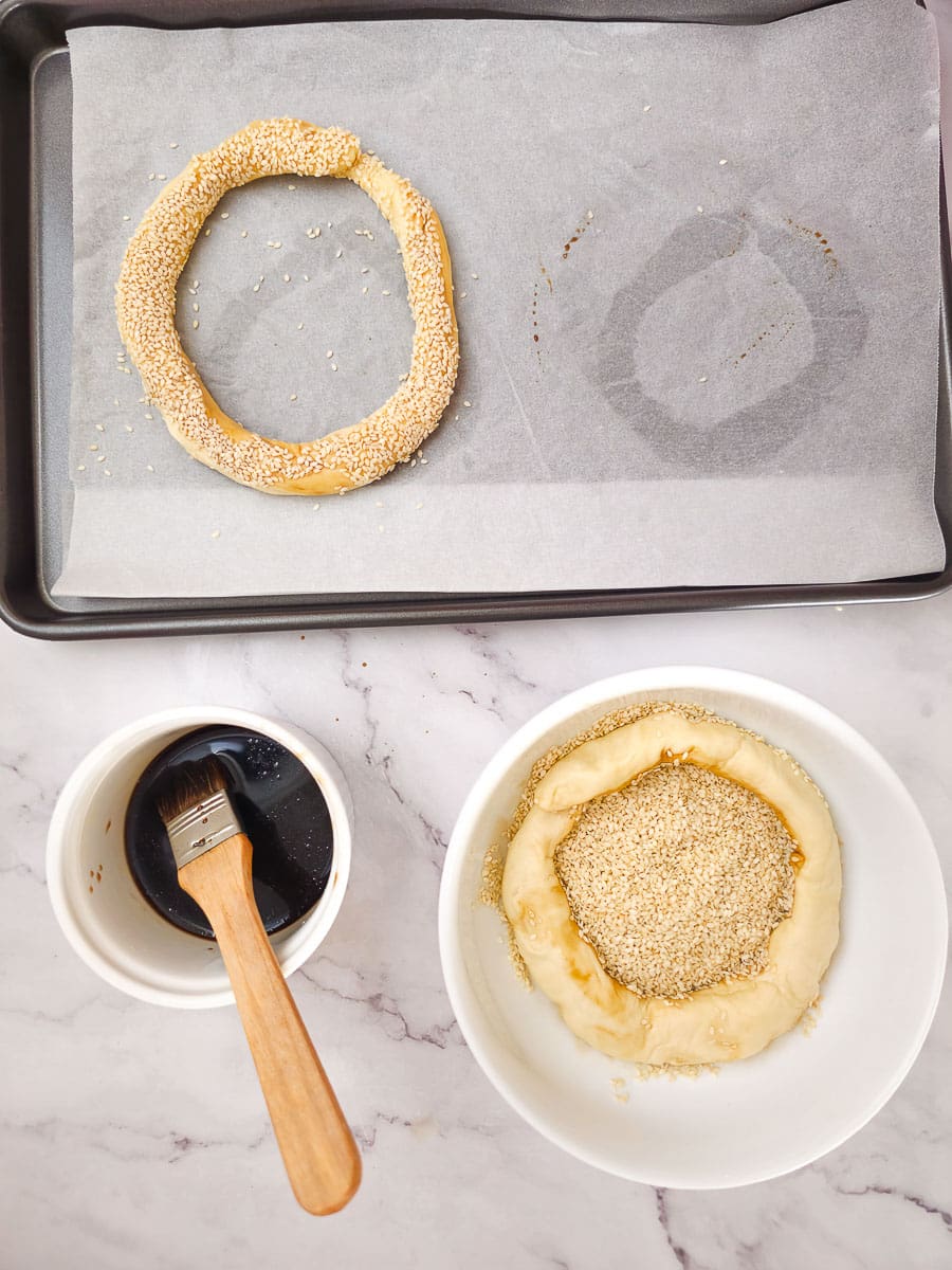 Greek Sesame Bread Rings - Koulouri Thessaloniki coating with sesame seeds