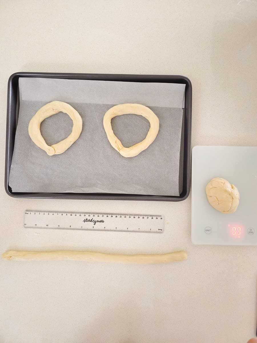 shaping - Greek Sesame Bread Rings - Koulouri Thessaloniki - on baking tray and scales