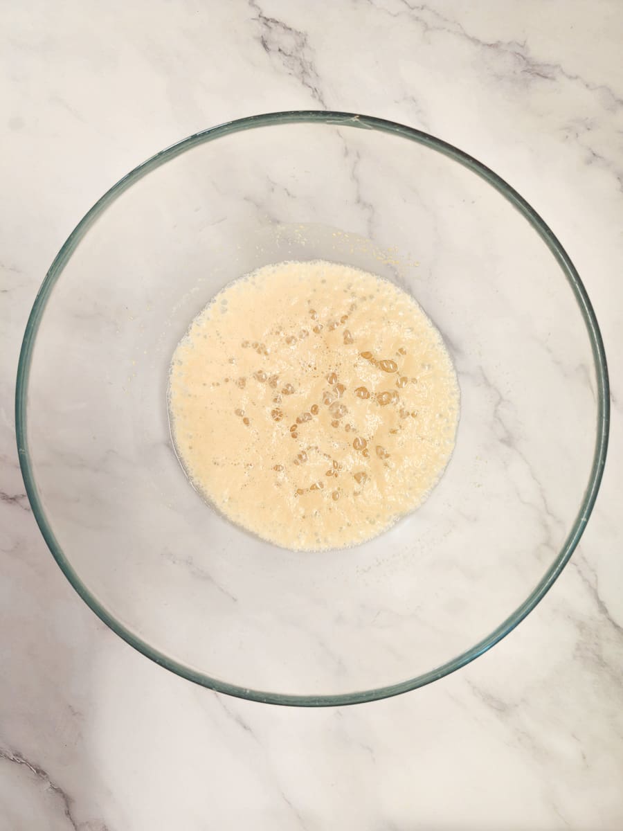 yeast mixture activating in a bowl