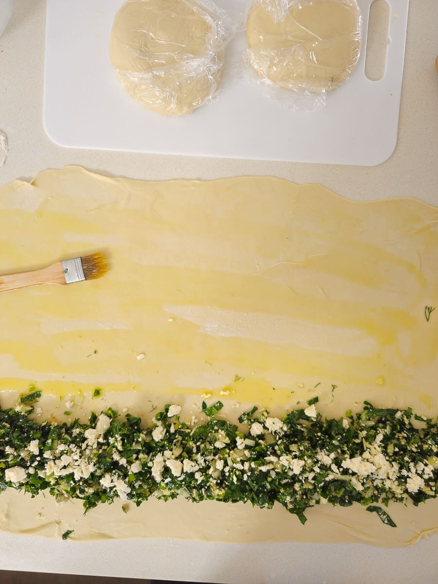 adding spinach to dough