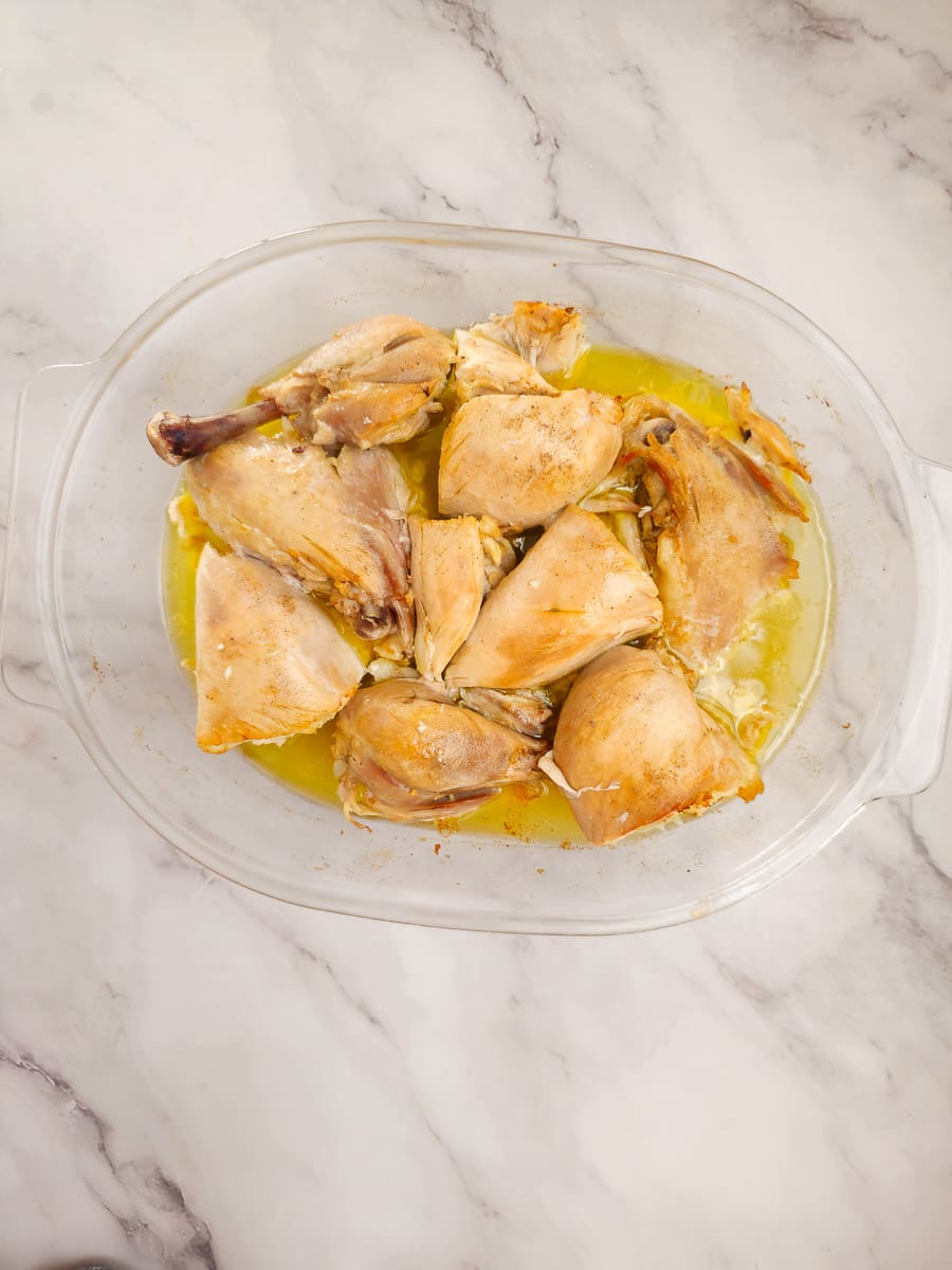 baked chicken pieces in a baking dish