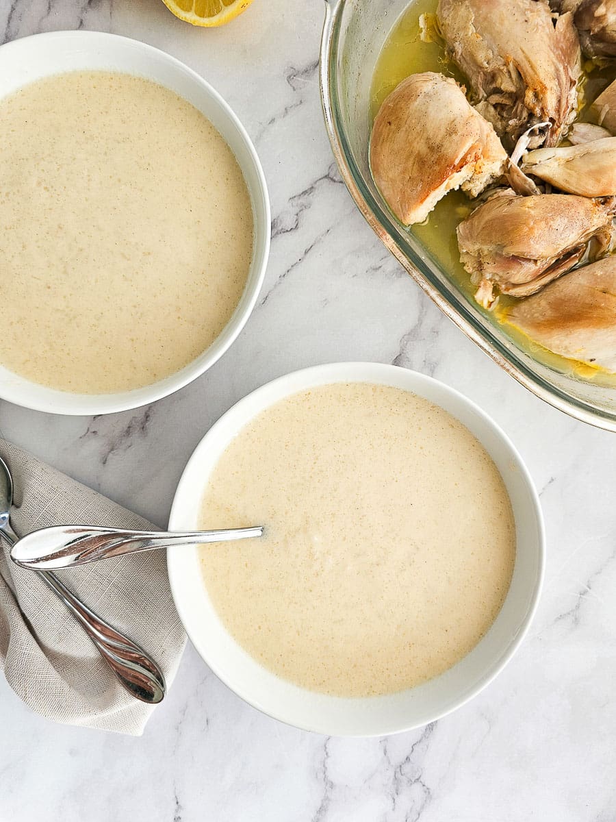 Greek lemon chicken soup avgolemono in bowls with chicken