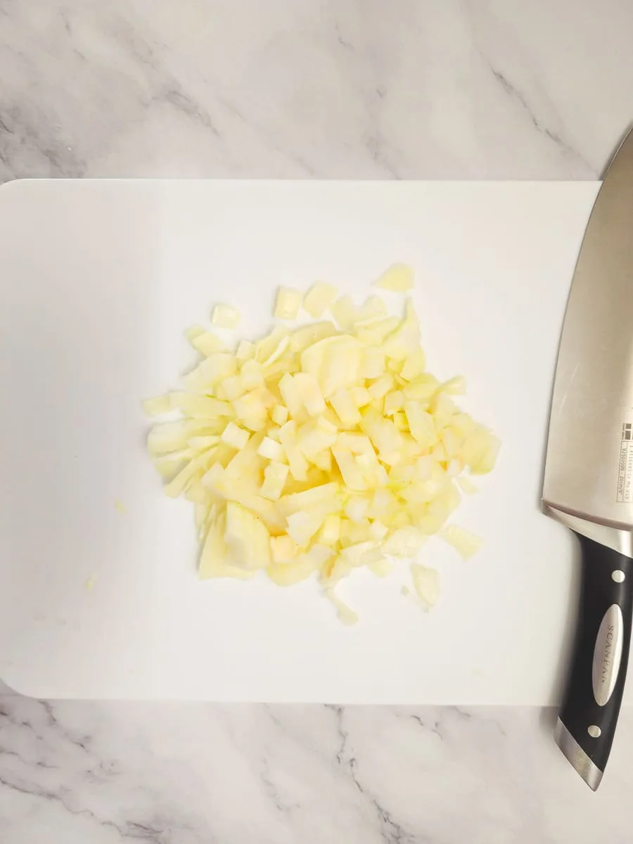 dicing onions on chopping board