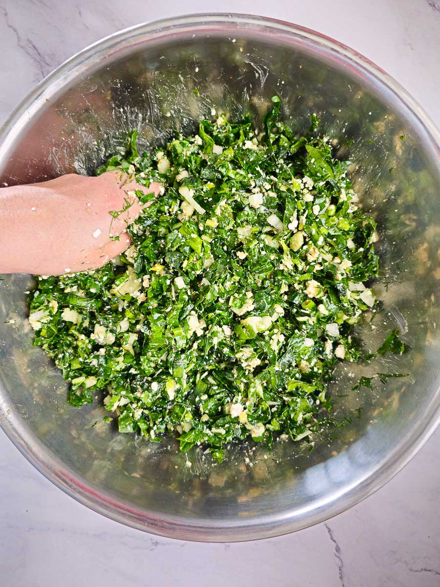 mixing ingredients for spanakopita