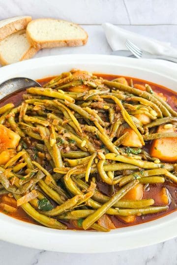 Fasolakia -Green Beans with potatoes on a plate