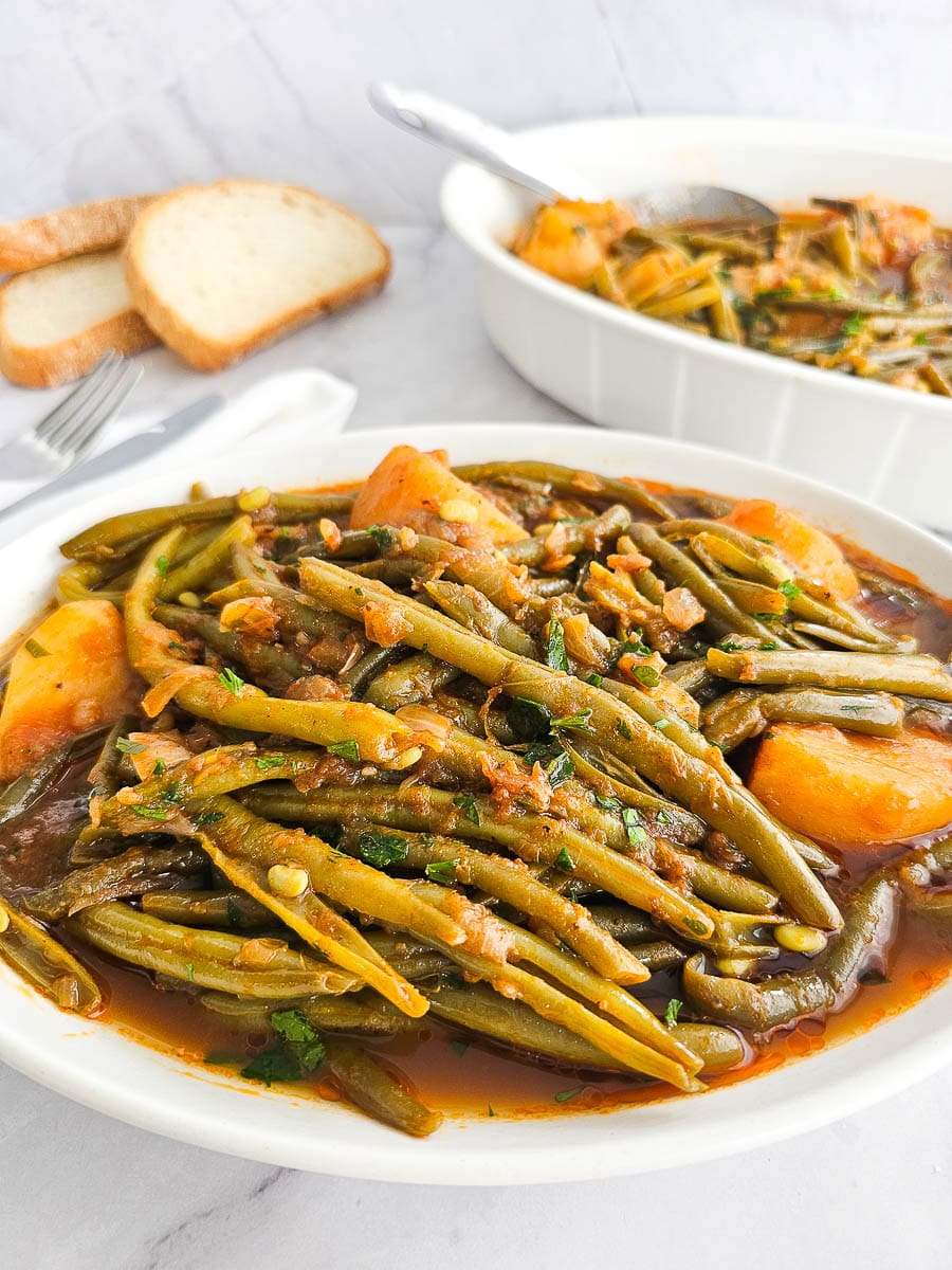 Fasolakia -Green Beans with potatoes on a plate