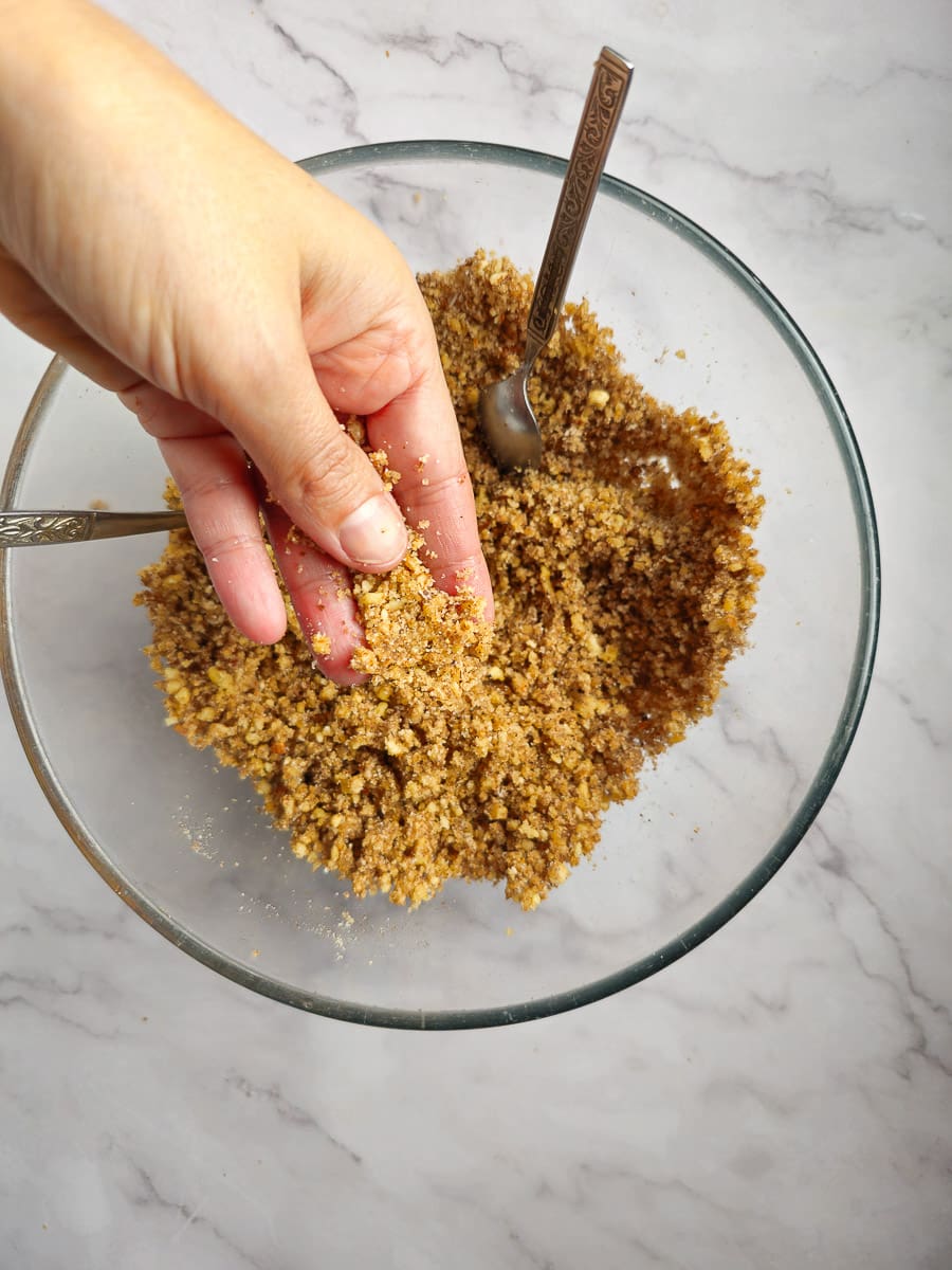 crushed walnuts and almonds in a bowl