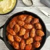 Soutzoukakia - Greek meatballs in tomato sauce in a saucepan