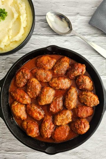 Soutzoukakia - Greek meatballs in tomato sauce in a saucepan