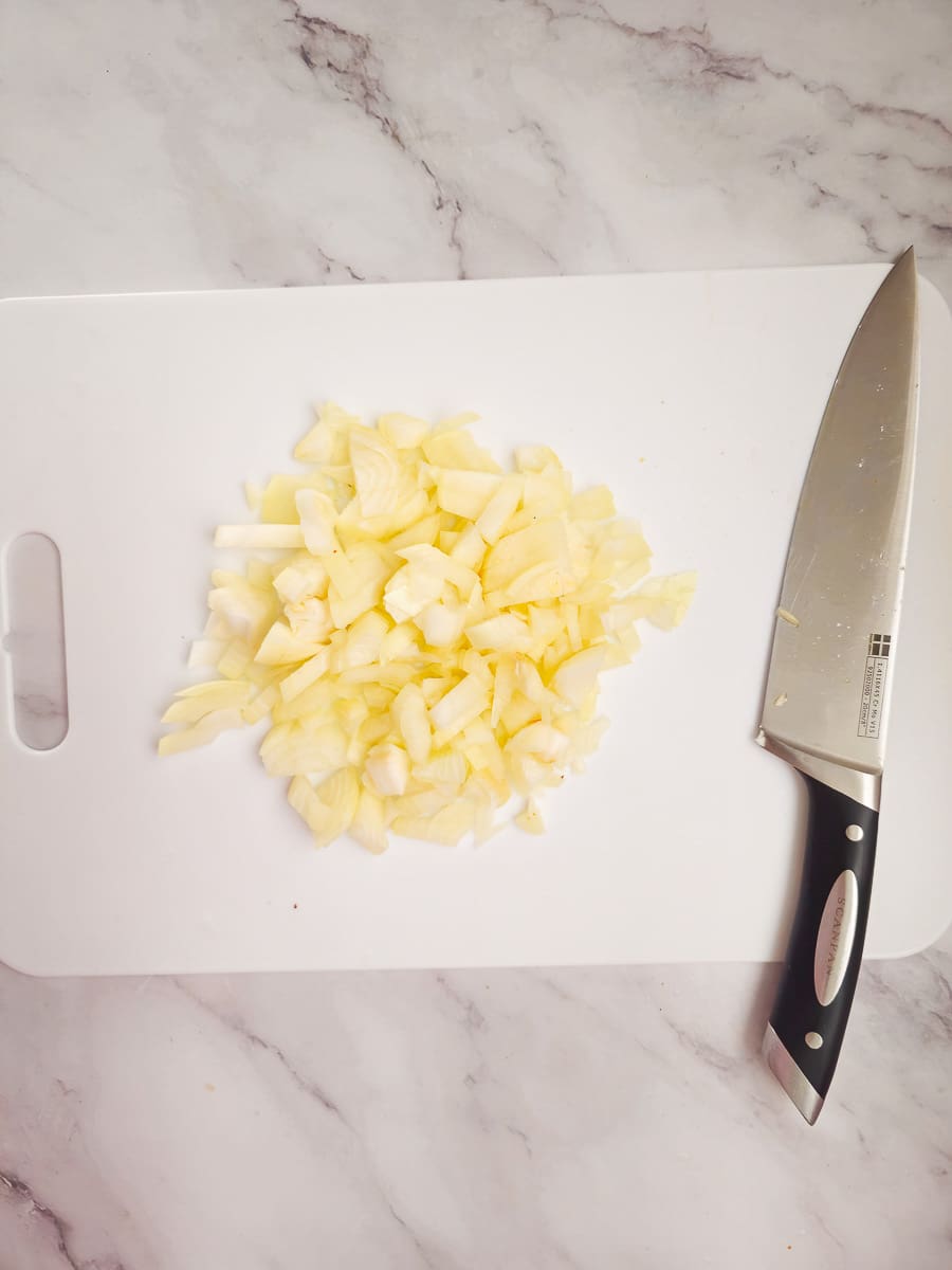 dicing onions on chopping board