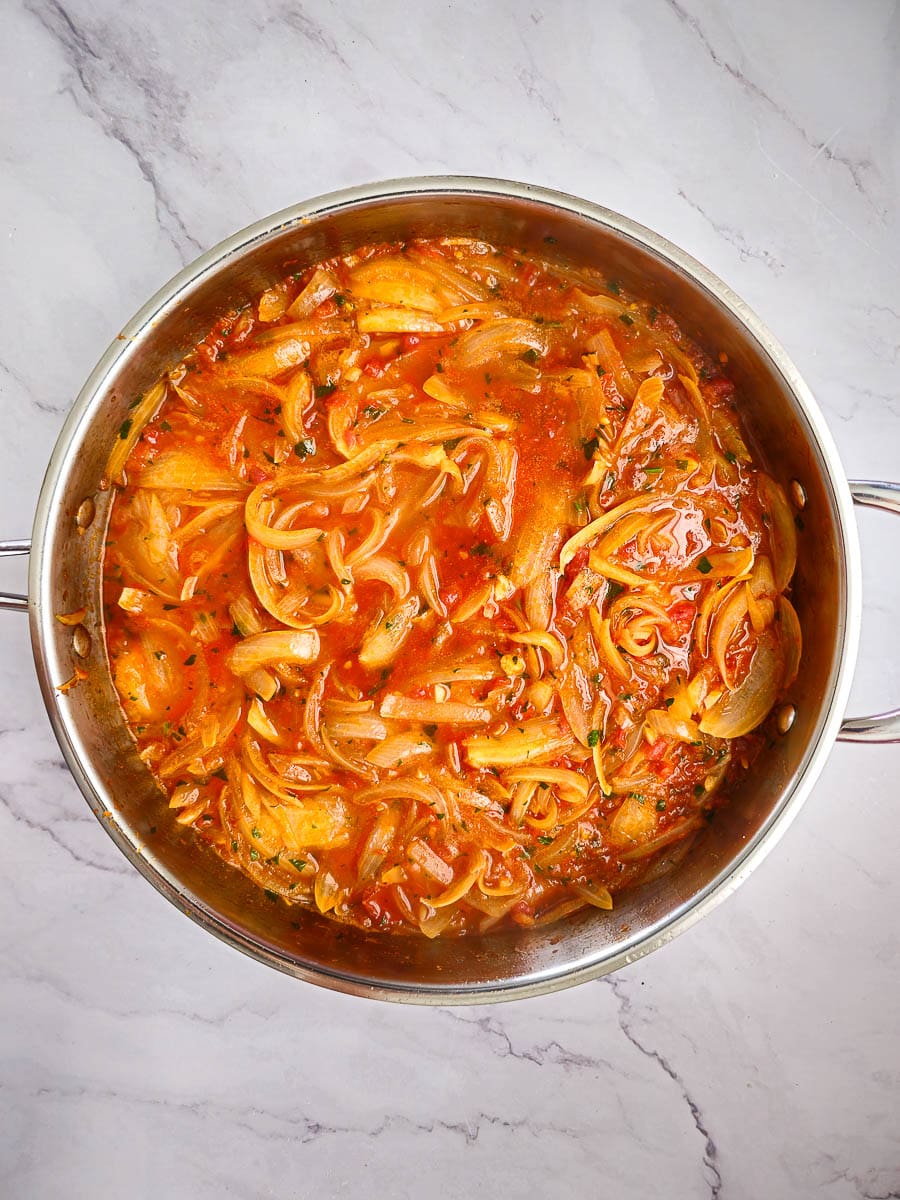 sauteing onions in tomato sauce