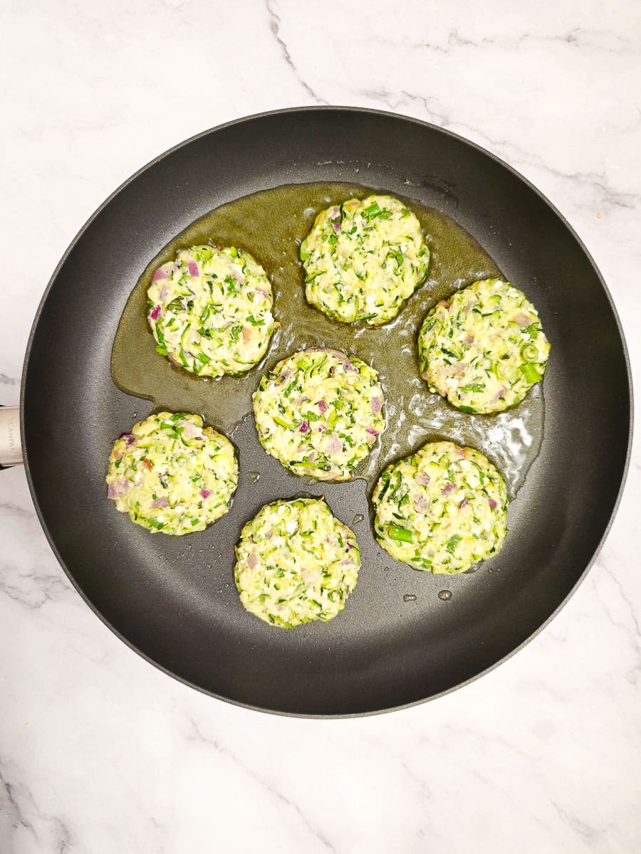 Greek zucchini fritters - kolokithokeftedes mixture in a bowl