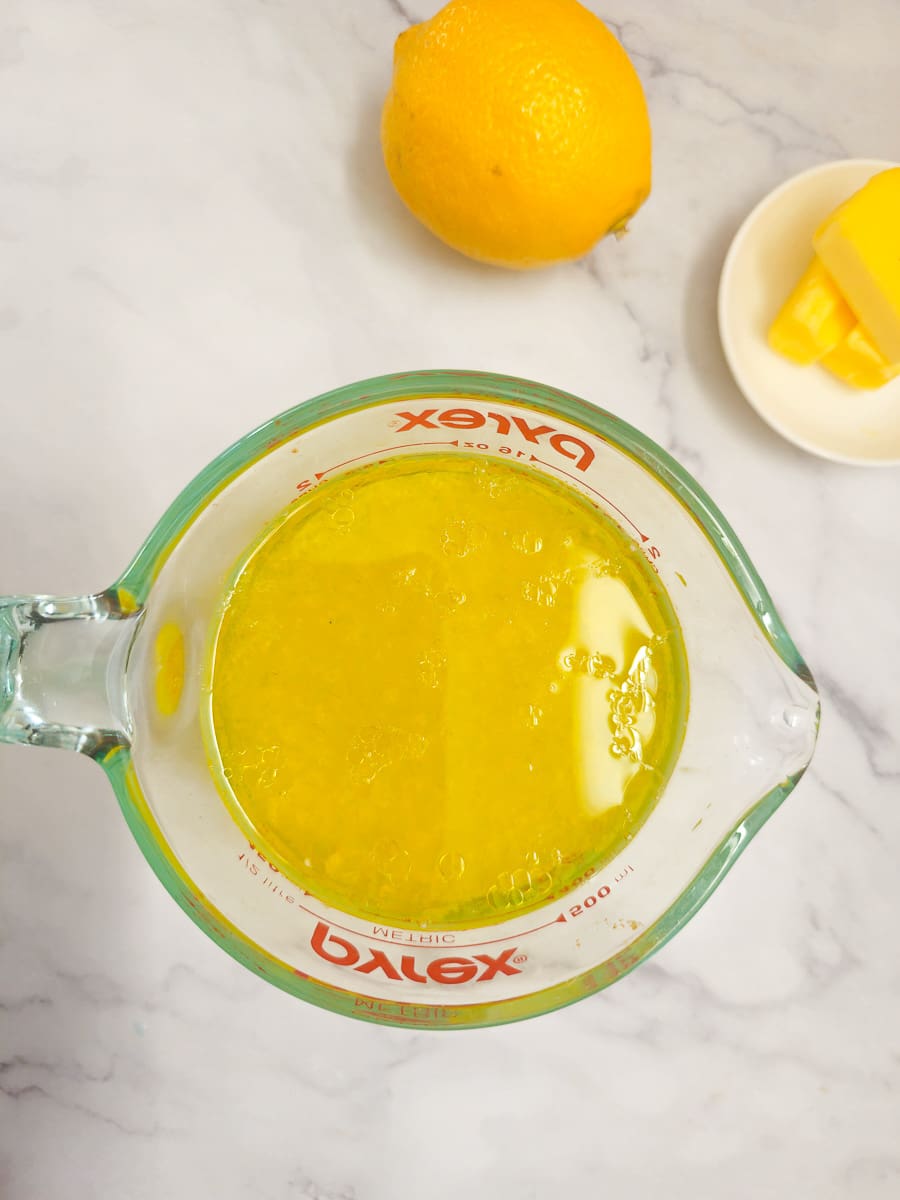 olive oil and lemon sauce in measuring jug