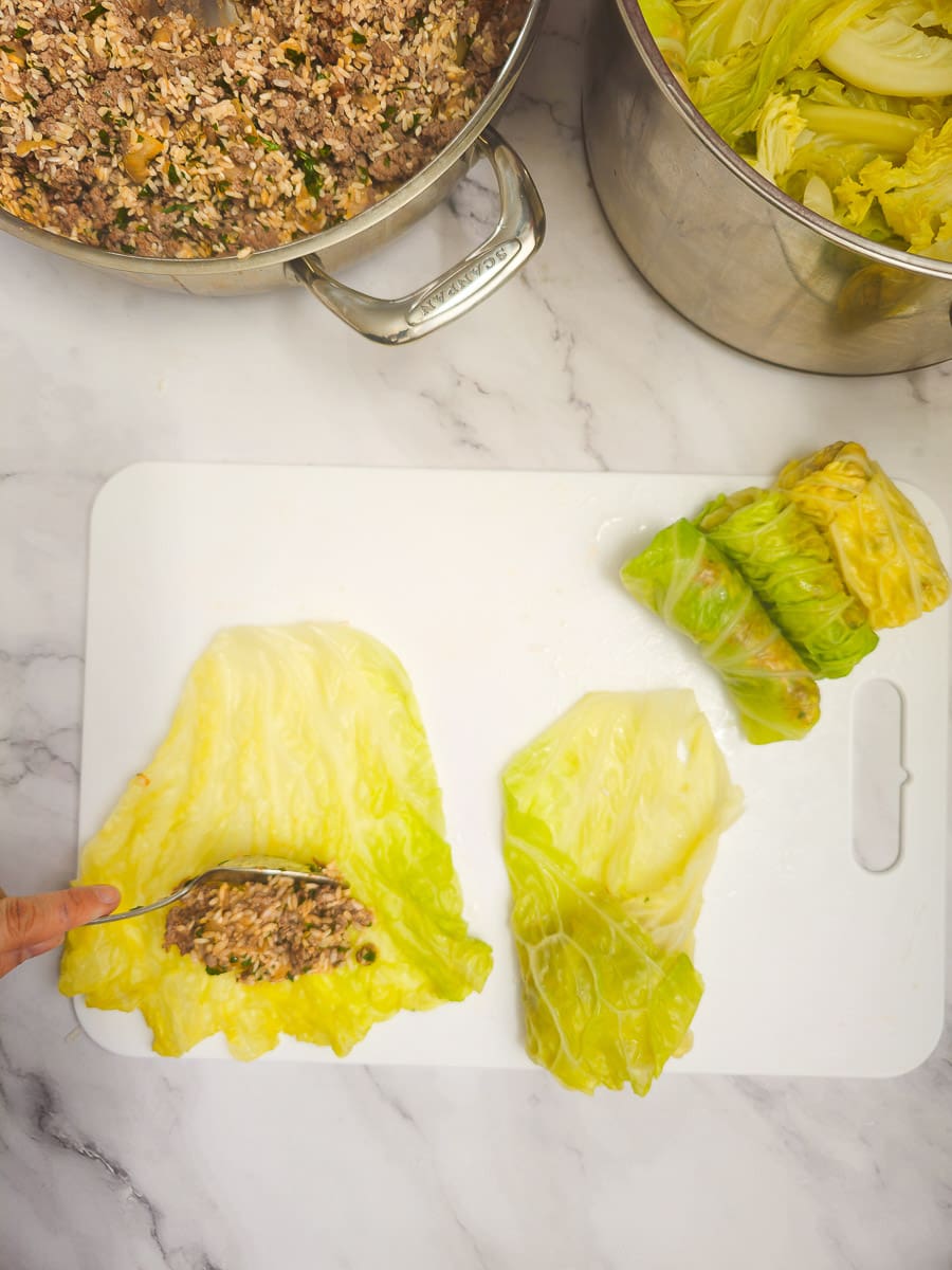 Lahanodolmades-Greek Stuffed Cabbage Rolls - rolling cabbage rolls