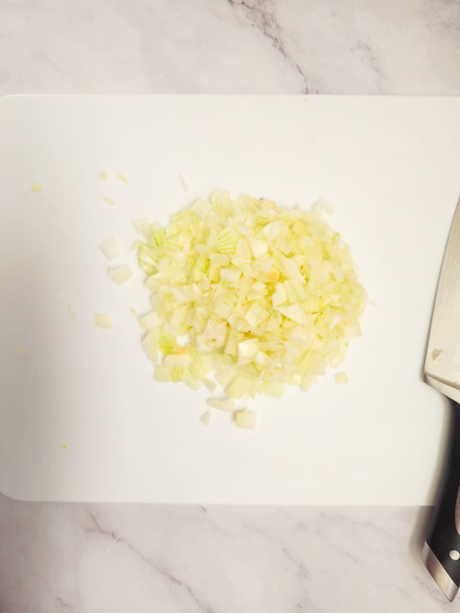 dicing onions on chopping board